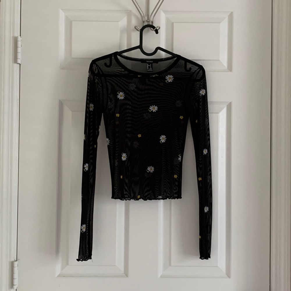 Cute seem thru long sleeve top. Size small.